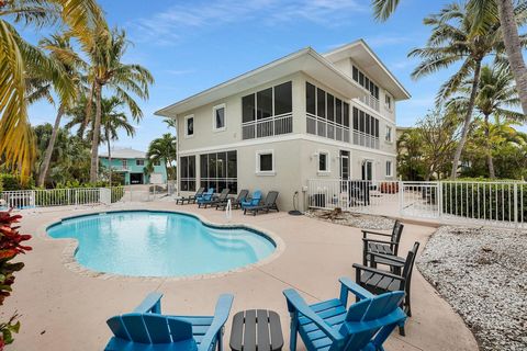 YOUR ULTIMATE ESCAPE to paradise awaits...This EXPANSIVE 5 bed / 3 bath waterfront CBS home boasts a fantastic location, LARGE lot size, A metal roof, pavered driveway, 98' of CONCRETE dockage, a new 20K lbs BOAT LIFT, 3 New AC's w/ UV system/air scr...