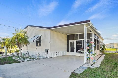 Under contract-accepting backup offers. Welcome to waterfront living at its finest in the esteemed community of Parkhill Estates, nestled in the charming Punta Gorda. This meticulously maintained double wide manufactured home offers a serene retreat ...
