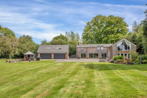 This beautifully appointed detached barn conversion in quiet backwater enjoys a private semi-rural setting and uninterrupted countryside views. Set behind electric gates in just under 1.5 acres of mature grounds The Orchard has 18th century origins a...