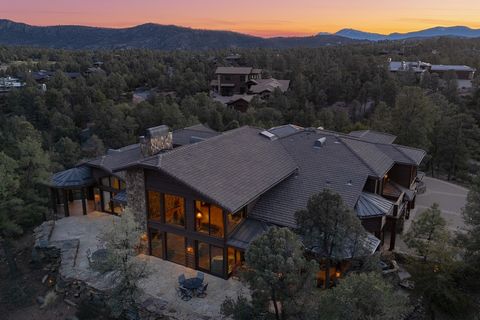 Welcome to this extraordinary residence nestled within the scenic beauty of The Rim Golf Club in Payson, Arizona. This custom-built home by Amon Builders showcases unparalleled craftsmanship and stunning features. Positioned along the 5th fairway on ...