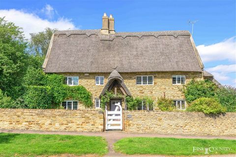 A chocolate box pretty, Grade II listed, 17th century, thatched stone cottage presented in exceptional order offers 3 double bedrooms, including a superb master bedroom suite, a well-appointed family bathroom, a kitchen dining room, utility room and ...
