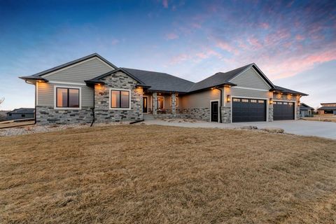 Imagine sitting on a covered deck watching the sunset, while you are nestled on a quiet acre inside the city. This stunning newly built home offers timeless design and trendy interior features that highlight living spaces with fun lighting, backsplas...