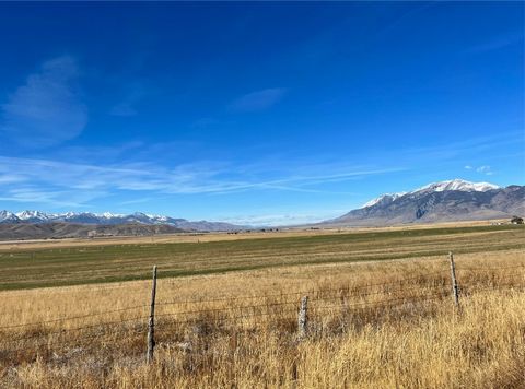 This 2,559+ acre ranch spanning across 13 parcels located in Butte and Custer Counties represents an opportunity to own productive agricultural property in the heart of Idaho. Priority water rights, pivot-irrigated farmland, extensive grazing land, a...
