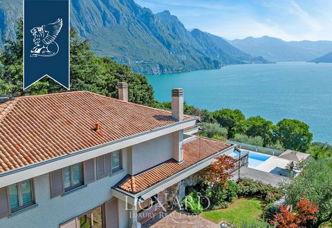 A magnificent modern villa is sold with a view of the Iseo Lake in Riva Di Solto. The internal area is 900 square meters. plus additional180 square meters in a separate extension for staff. A plot of more than 5,000 square meters includes olive trees...