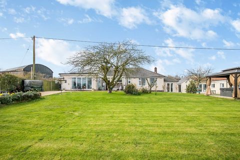 Situated in the beautiful village of Kempley, between the market towns of Ross-on-Wye and Ledbury, this spacious single- storey property boasts several acres of land, beautiful countryside views and a pair of annexes providing a regular income. The h...