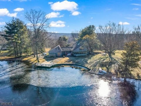 Vacation home living all year round in this Contemporary style home on a stunning 4+ acre lakefront property on private Mecca Lake! Sits deep off the main road with a long driveway that leads you up to this magnificent oasis boasting a contemporary s...