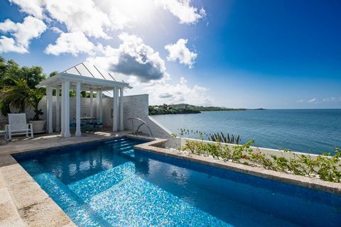 Discover this stunning Caribbean-inspired oceanfront home, a true masterpiece with breathtaking sea, sunset, and distant island views. Nestled in the exclusive, gated Carden Beach community, this immaculate 3-bedroom, 3-bath residence offers luxury, ...