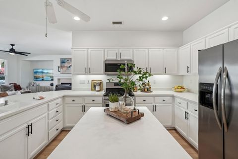 Nestled in a serene cul-de-sac, this stunning Oasis Plan redefines comfort and style with 1,551 sq. ft. of meticulously designed living space. Boasting 2 bedrooms and 2 baths, this home welcomes you into a light-filled great room featuring a tile-enc...