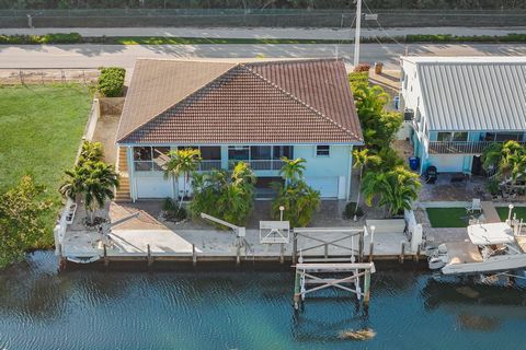 Discover the perfect blend of quality craftsmanship and waterfront convenience in this stunning 3-bedroom, 3-bathroom home. Built with solid CBS construction, this residence is designed to last and offers an inviting, open layout. Just minutes from o...