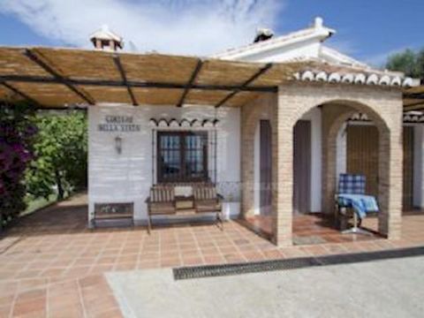 This spacious charming house is set in a good sized plot with grapevines. It has got a vegetable garden and a solar-heated swimming pool (from April to October). There are wonderful views over the mountains and sea. Living space comprises a living ro...