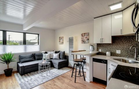 Mid-century Modern cute as a button 1 bed + 1 bath in the heart of Noe Valley! This Top floor detached end unit provides a comfortable living area with a big window, remodeled eat-in kitchen featuring quartz counters, dining bar, mosaic tiled backspl...