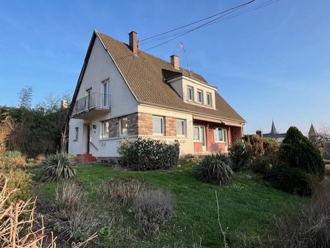 This house built in 1975, well laid out, offers 8 rooms on 2 levels, a beautiful terrace, 2 balconies, a large cellar with the possibility of storing 2 cars and surrounded by a pretty garden sunny on all sides. The ground floor consists of an entranc...