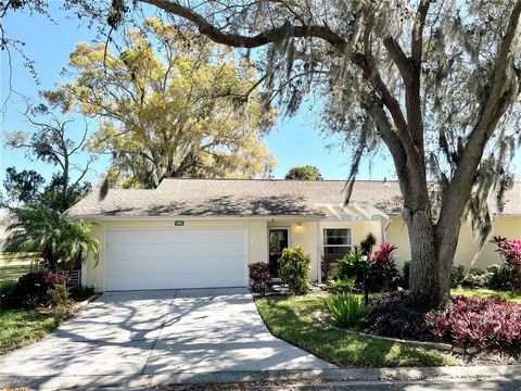 Welcome to Oakhurst! An inviting, oak-lined, 55+ community in a convenient Sarasota location. This very well-maintained, 2 bedroom, 2 bath home is a in highly desirable part of Oakhurst, with large oak shade and next to a large open lot, with views o...