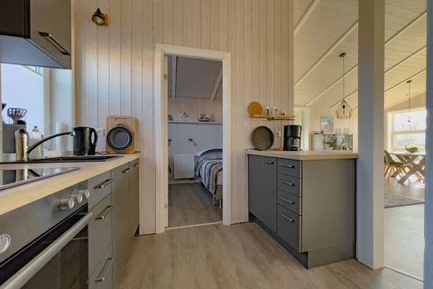 Confortevole casa vacanze di qualità con sauna dal design danese, situata nel parco sulla spiaggia del Mar Baltico, a breve distanza dal centro della città di Grömitz.