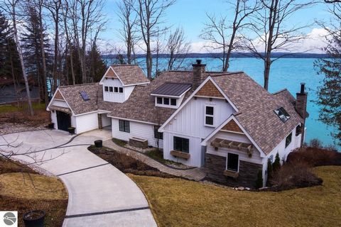Stunning Torch Lake Home. This luxurious yet relaxed home is the perfect lakeside retreat set on 150 feet of private frontage overlooking the gorgeous caribbean blue of Torch. The home was totally redone in 2018 down to the studs, including new plumb...