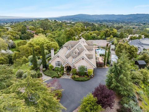 Circular driveway leads to this luxuriously appointed home atop a gentle knoll. Views encompass a glorious sunrise, Windy Hill, Huddart Park. Level backyard, in-ground pool, fabulous outside entertaining patio w/ built-in BBQ, pizza oven & refrigerat...