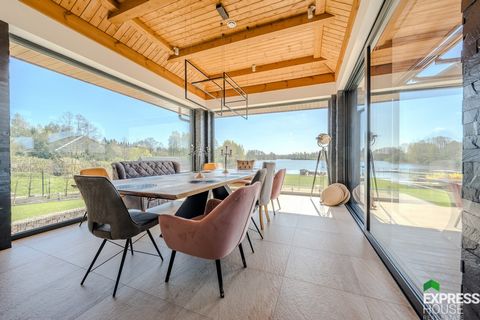 Exclusive Passive Lake House with Shoreline We offer a unique two-storey house with a basement, built in 2020, located on a spacious plot of 2914m2 in the charming village of Bienie, Ełk commune. This property provides not only exceptional comfort, b...