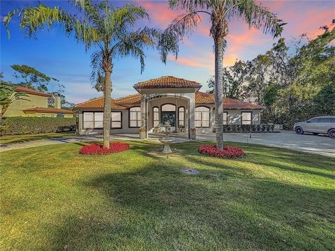 This Amazing Waterfront Custom Built Estate feels more like your Personal 5 Star Resort with all the Amenities that it has to offer! The Grounds encompass over 3 Acres, including the riparian acreage of .378. You will be greeted by a Private, Electro...