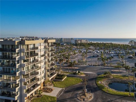 One or more photo(s) has been virtually staged. Welcome to this beautifully renovated condominium situated just steps away from the renowned Siesta Beach, famous for its soft, powdery sand. This stunning end unit on the third floor boasts breathtakin...