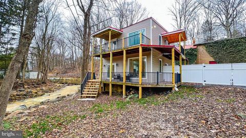 BACK ON THE MARKET ! NEW IMPROVED PRICE!!! HOME BY A STREAM! Previously used as an Airbnb! Welcome to this completely remodeled home, where every detail has been carefully considered and upgraded from the studs up. As you step inside, you'll immediat...