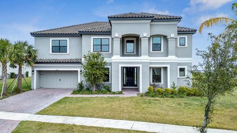 One or more photo(s) have been virtually staged. Welcome to your new home in the resort-style community of Bellalago. This waterfront single-family home sits on an oversized lot of .39 acres, providing plenty of space to add your future dream pool. W...