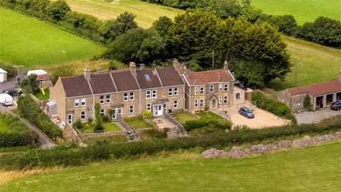 Built during the interwar era as a farm workers cottage, this charming three-bedroom Bath stone-built home sits mid-terrace in a row of six homes in an elevated position with wonderful valley views. Located just north of Dunkerton village and only a...