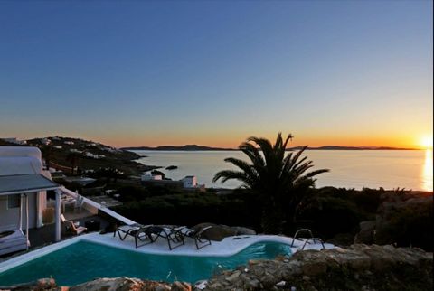 Nestled between the exclusive areas of Aleomandra and Agios Ioannis, this property is a rare gem offering breathtaking Sunset views over the mystical island of Delos, the birthplace of Apollo, the Sun God. This luxurious retreat is designed for peace...