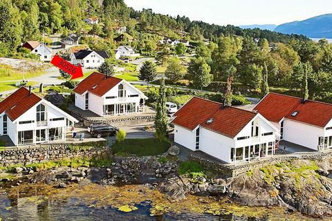 A luxury holiday cottage with a swimming pool (15 m²), whirlpool and sauna, and a panoramic view of the fjord. The house is located right by the sea. The house is an environmentally friendly low-energy house with low energy costs. Rooms, pool and wat...