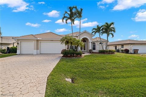 Florida Luxury Living - Direct Gulf Access Pool home with all the amenities for the sunshine lifestyle. Gorgeous curb appeal as you approach this custom built home with a lovely tile roof, stamped concrete drive and walkway, 3 car garage and beautifu...