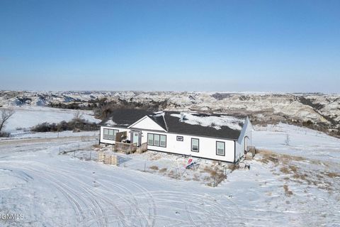 Rare opportunity alert! Discover breathtaking views and stunning sunsets at this exceptional 4864 sq ft home nestled on 5.10 acres of serene countryside living. Surrounded by sprawling ranch land and the majestic Missouri River breaks and Badlands, t...