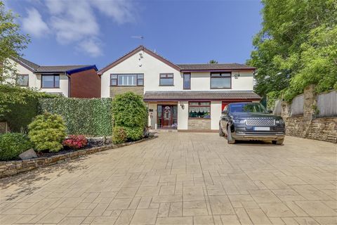 This unusually generous, detached family home is well-presented throughout and has multiple reception rooms, 5/6 bedrooms, an integral garage and ample driveway too. All accessed through a private, electric-gated entrance, this property enjoys an ele...