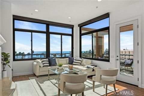 Experience coastal luxury in this rare two-story ocean-view penthouse at The Village in Redondo Beach. With 1, 889 square feet of living space, this updated beach residence offers bright, spacious interiors flooded with natural light. Watch the sailb...