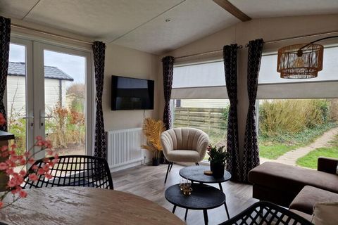 This detached chalet is located in a holiday park on the Wadden Sea. The accommodation is very suitable to use as a base to discover North Holland. The chalet features a practical and comfortable layout, with an open kitchen and a modern sitting area...