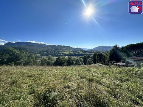 VIEW OF THE PYRENEES Land of 1257 m² on the heights of Saint Girons, connected to electricity. This slightly sloping terrain offers a lovely unobstructed view of the Pyrenees. A few minutes walk from the city center, it is ideally located. Fees inclu...