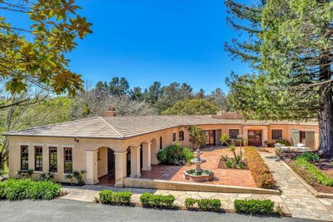 Situated on a generous approximately four- acre parcel, this extraordinary Spanish-style home is enveloped by lush foliage and majestic trees, creating a private and secluded atmosphere. At the entrance of the home, a stunning high-ceilinged corridor...