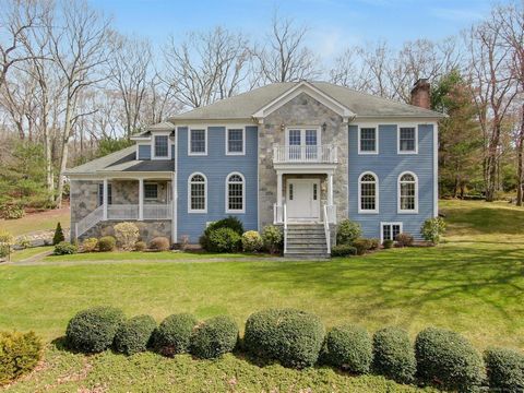 Embrace luxury in this meticulously maintained Colonial home. The foyer welcomes with a Cathedral ceiling and crystal chandelier. Explore formal living and dining areas, a spacious kitchen with a wet bar, and a family room with a stone fireplace. Fin...