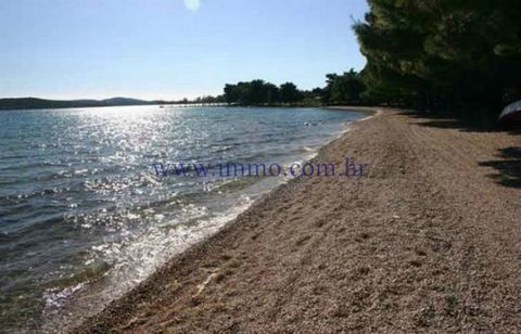 EXCLUSIVE AGENCY SALE! A unique plot of land of 8,500 m2 is for sale, located in an exceptional location, first row to the sea, in the suburbs of Šibenik. The plot is located next to the beach in the construction zone for tourist purposes T1 and T4 a...