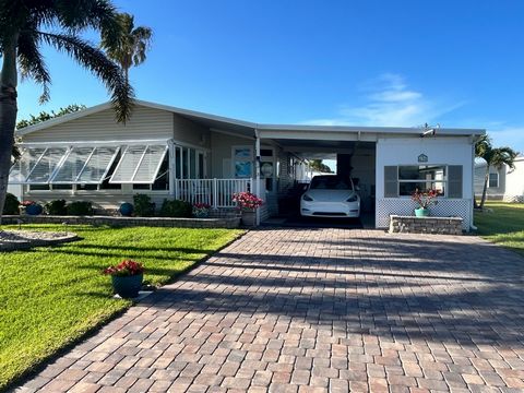 Experience what Sebastian has to offer with this 2/2 Palm harbor fully furnished home in a very active community. This home has one of the few paver driveways and multiple sheds that hold storm shutters and an incredible workshop for anything else. T...