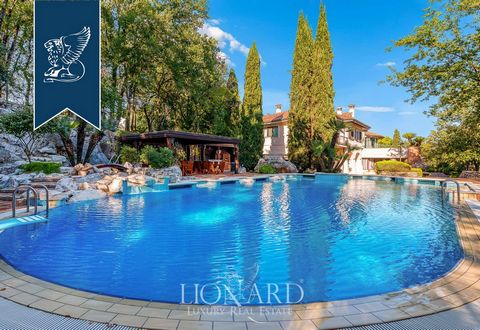 For sale in the picturesque Liri Valley, between Rome and Naples, this extraordinary luxury villa spans 1,350 sqm across three floors, featuring 13 bedrooms, 12 bathrooms, and an annexe. Nestled in a 3.5-hectare garden, the property includes an infin...