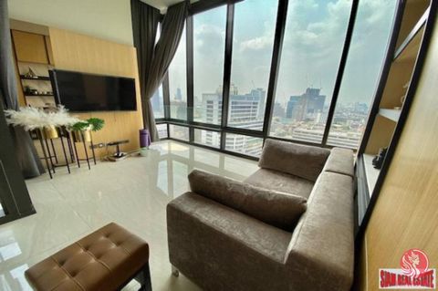 This two bedroom, two bath condo for sale is situated in a very good Silom location. It has an open living plan with a flat screen TV, dining area and a fitted western kitchen that includes an electric stove, hood, refrigerator and washing machine. T...