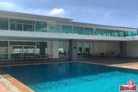 Big house, fully customized by the owner, in the East-side of Pattaya in Huay Yai area, not far from the expressway to Bangkok or Rayong. 4 Bedrooms, 3 Bathrooms, 350sq.m of living areas, high ceilings Living room 85sq.m with 7 meter high ceiling All...