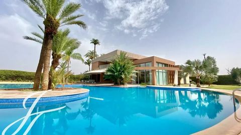 This magnificent estate is enviably located in the most soought after part of the exclusive Palmeraie, a mere 5 minutes from downtown Marrakech Set on a meticulously landscaped 1 hectare park, the grounds include the villa with modern lines and a dra...