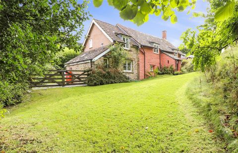 Location The surrounding Holnicote Estate covers c.12,000 acres of the Exmoor National Park with stunning views and features five picturesque villages, a shingle beach and ancient woodland while a comprehensive range of local amenities can be found i...