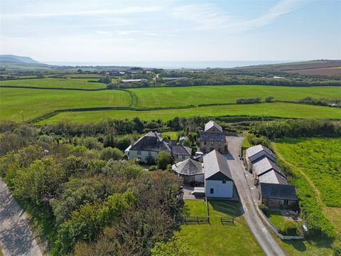 Main Farmhouse: Believed to date back to the mid-17th century, the superbly presented farmhouse exudes character with original features throughout. The entrance hall welcomes you with flagstone slate flooring, leading to the living room with its dual...