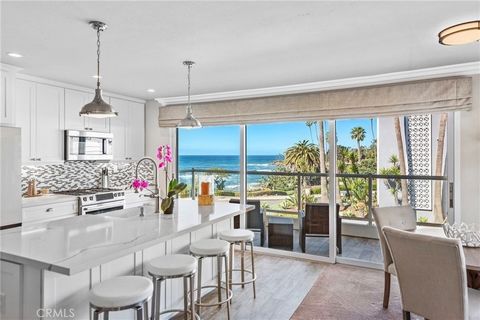 Incredible North Laguna Beach location with stunning Catalina, white water and coastline views throughout. This beautifully remodeled one bedroom condo is located on the front row corner of Cliff Drive and Myrtle, across the street from the famed Hei...