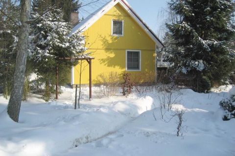 Scandinavian wooden house with a red tiled roof in a decentralized and quiet location, with a covered terrace in front, equipped with comfortable garden furniture. Even in bad weather, you can still take advantage of the opportunity to sit protected ...