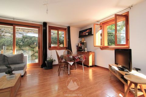Route du Pont, large 2-room apartment of 47 m2 on the ground floor of a small condominium dating from 2005. The apartment is composed of a large living room - with open plan kitchen - opening through a large window onto a corner terrace surrounding t...