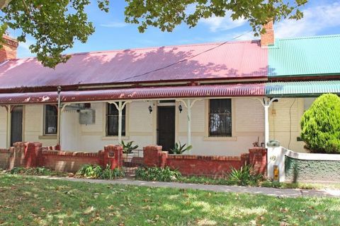 Located within the CBD of bathurst in a leafy st and a pleasant walk to restaurants and parks and a 5 minute walk to the Bathurst Railway station this Quaint and Charming double brick semi features Bull nose verandah & high ceilings. Boasting a seper...