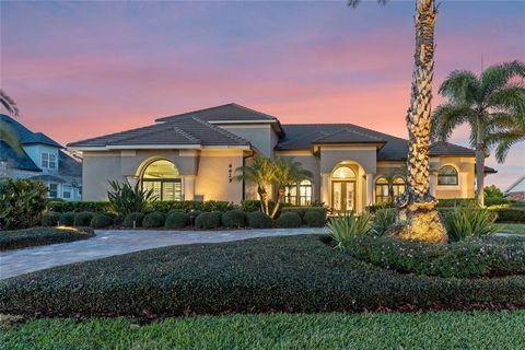 CHAMPIONSHIP GOLF COURSE HOME IN BAY HILL! Imagine a panoramic vista of the 11th Fairway of Arnold Palmer's Championship Course; as well as surrounding views of the 12th-14th holes of golf...all From your living room, family room and kitchen; as well...