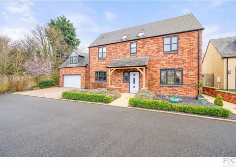 ‘Contemporary and spacious: a wonderful family home.’ Well maintained and imposing Situated amongst an exclusive development of five properties, this delightful four bedroomed house has one of the largest plots and sits beyond the security provided b...